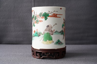 A Chinese famille verte brush pot on wooden stand, Kangxi