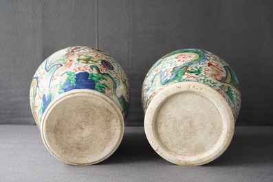 A pair of Chinese wucai &lsquo;dragon and phoenix&rsquo; vases, Transitional period