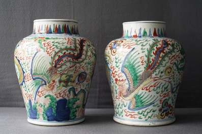 A pair of Chinese wucai &lsquo;dragon and phoenix&rsquo; vases, Transitional period