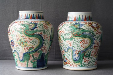 A pair of Chinese wucai &lsquo;dragon and phoenix&rsquo; vases, Transitional period
