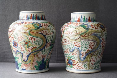 A pair of Chinese wucai &lsquo;dragon and phoenix&rsquo; vases, Transitional period