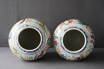 A pair of Chinese wucai &lsquo;dragon and phoenix&rsquo; vases, Transitional period