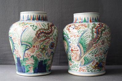 A pair of Chinese wucai &lsquo;dragon and phoenix&rsquo; vases, Transitional period