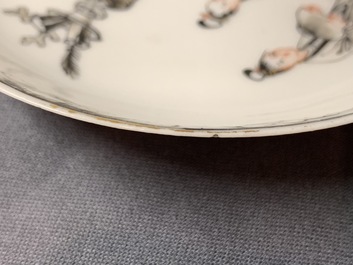 A pair of Chinese grisaille and gilt cups and saucers, Qianlong