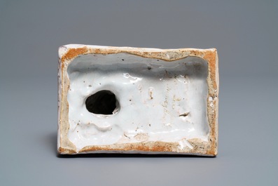 A manganese and yellow Brussels faience model of a dog, 18th C.