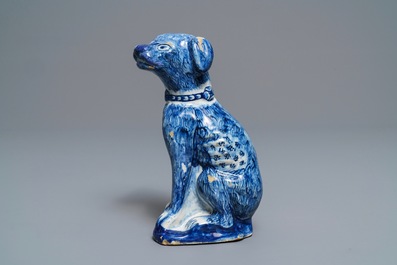 A Dutch Delft blue and white model of a dog, 1st half 18th C.