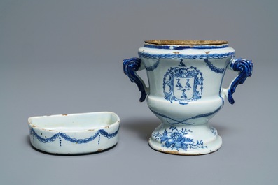 A Dutch Delft blue and white armorial 'campana' vase on stand, 18th C.
