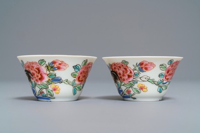 A pair of Chinese famille rose 'roosters' cups and saucers, Yongzheng/Qianlong