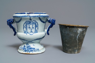 A Dutch Delft blue and white armorial 'campana' vase on stand, 18th C.