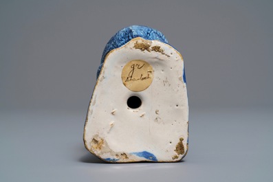 A Dutch Delft blue and white model of a dog, 1st half 18th C.