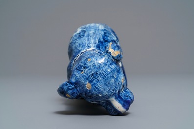 A Dutch Delft blue and white model of a dog, 1st half 18th C.