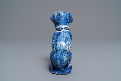 A Dutch Delft blue and white model of a dog, 1st half 18th C.