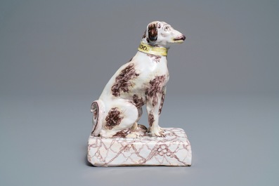A manganese and yellow Brussels faience model of a dog, 18th C.