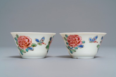 A pair of Chinese famille rose 'roosters' cups and saucers, Yongzheng/Qianlong