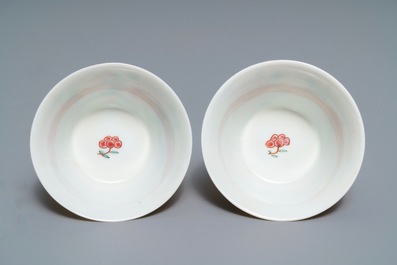 A pair of Chinese famille rose 'roosters' cups and saucers, Yongzheng/Qianlong