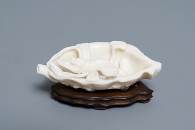 A Chinese Dehua blanc de Chine 'lobster on artemisia leaf' water dropper, Kangxi