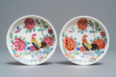 A pair of Chinese famille rose 'roosters' cups and saucers, Yongzheng/Qianlong