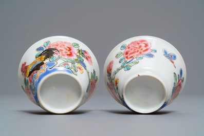 A pair of Chinese famille rose 'roosters' cups and saucers, Yongzheng/Qianlong