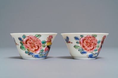 A pair of Chinese famille rose 'roosters' cups and saucers, Yongzheng/Qianlong