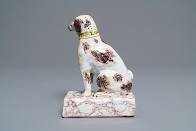 A manganese and yellow Brussels faience model of a dog, 18th C.