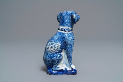 A Dutch Delft blue and white model of a dog, 1st half 18th C.
