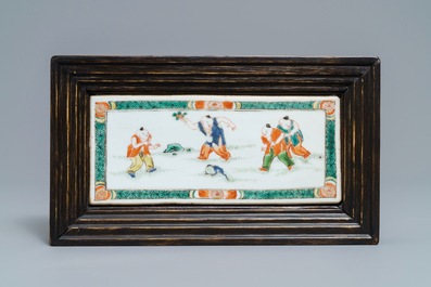A Chinese famille verte plaque with playing boys and a landscape bowl, Kangxi