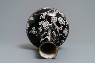 A Chinese famille noire tianqiu ping vase with birds among blossoms, 19th C.