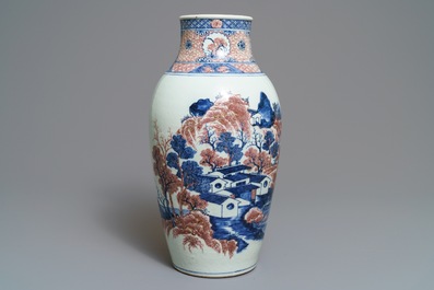 A Chinese blue, white and underglaze red landscape vase, 19th C.