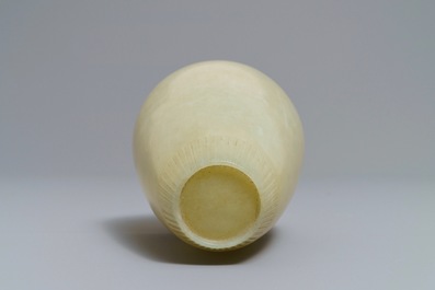 A Chinese light celadon jade relief-decorated meiping vase, 19/20th C.