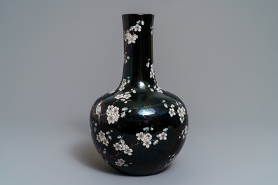 A Chinese famille noire tianqiu ping vase with birds among blossoms, 19th C.