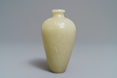 A Chinese light celadon jade relief-decorated meiping vase, 19/20th C.