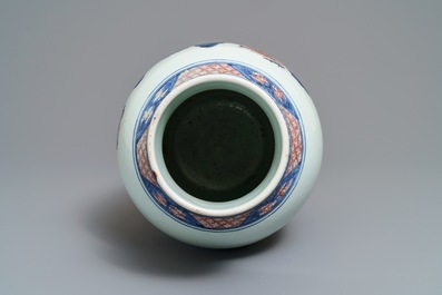 A Chinese blue, white and underglaze red landscape vase, 19th C.