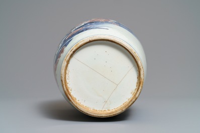 A Chinese blue, white and underglaze red landscape vase, 19th C.