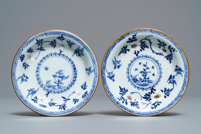 A pair of Chinese blue, white and underglaze red cups and saucers, Kangxi