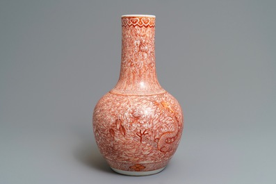 A Chinese iron red 'dragon and phoenix' bottle vase, 19th C.