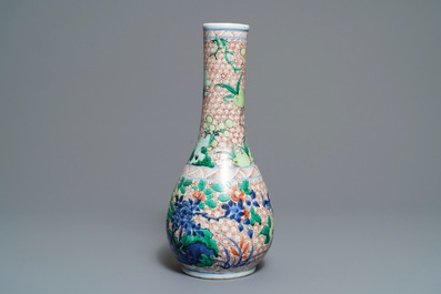 A Chinese wucai bottle vase with birds in a garden, Transitional period