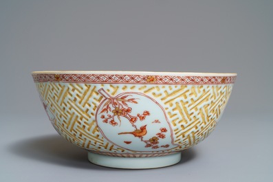 A Chinese iron red and gilt relief-decorated bowl, Kangxi