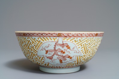 A Chinese iron red and gilt relief-decorated bowl, Kangxi