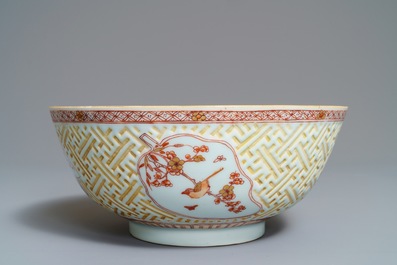 A Chinese iron red and gilt relief-decorated bowl, Kangxi