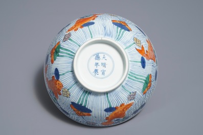 A Chinese doucai bowl with fish in a lotus pond, Xuande mark, Kangxi