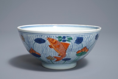 A Chinese doucai bowl with fish in a lotus pond, Xuande mark, Kangxi
