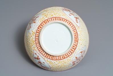 A Chinese iron red and gilt relief-decorated bowl, Kangxi