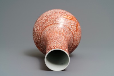 A Chinese iron red 'dragon and phoenix' bottle vase, 19th C.