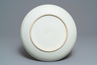 A Chinese famille rose charger with ladies in a garden, 19th C.