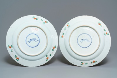 A pair of Chinese famille verte 'mythical beasts' chargers, Kangxi