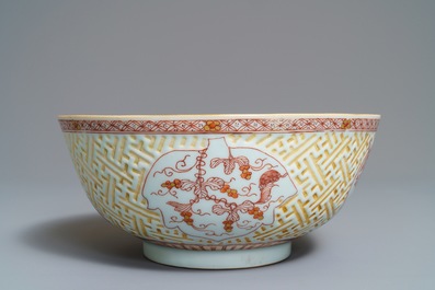 A Chinese iron red and gilt relief-decorated bowl, Kangxi
