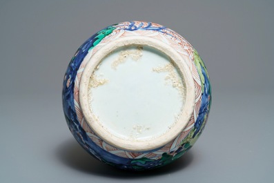 A Chinese wucai bottle vase with birds in a garden, Transitional period