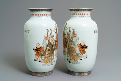 A pair of Chinese iron red, grisaille and gilt vases, Qianlong mark, 20th C.