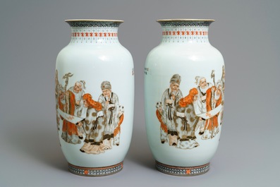 A pair of Chinese iron red, grisaille and gilt vases, Qianlong mark, 20th C.