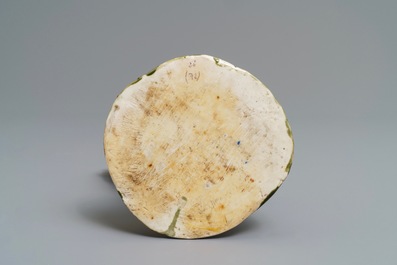 A Chinese verte biscuit group with a boy near a blossoming tree, Kangxi
